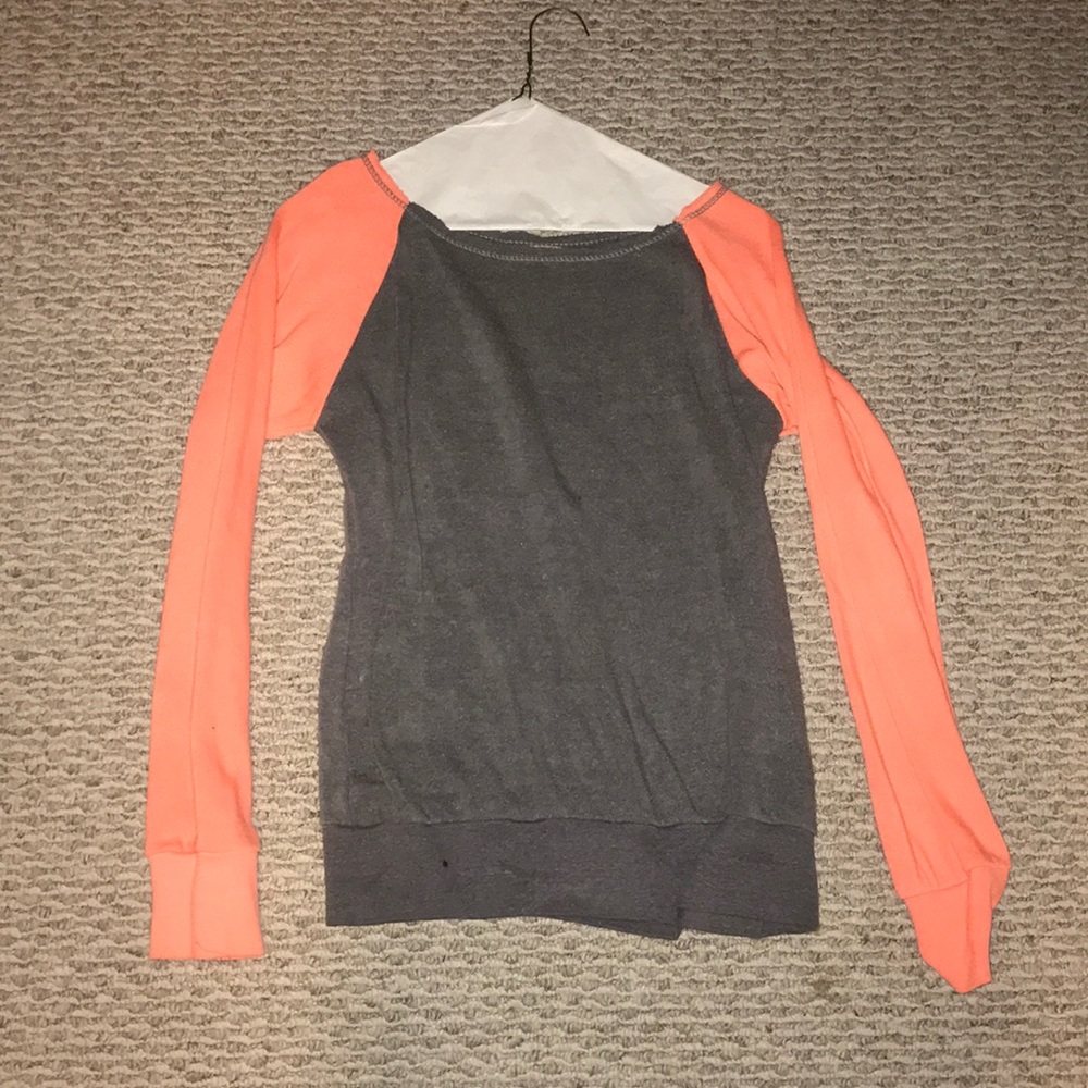 Gray crew neck with orange sleeves